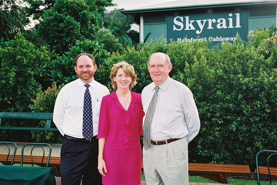 Ken Chapman standing with his sister Karen Hawkins and father George Chapman