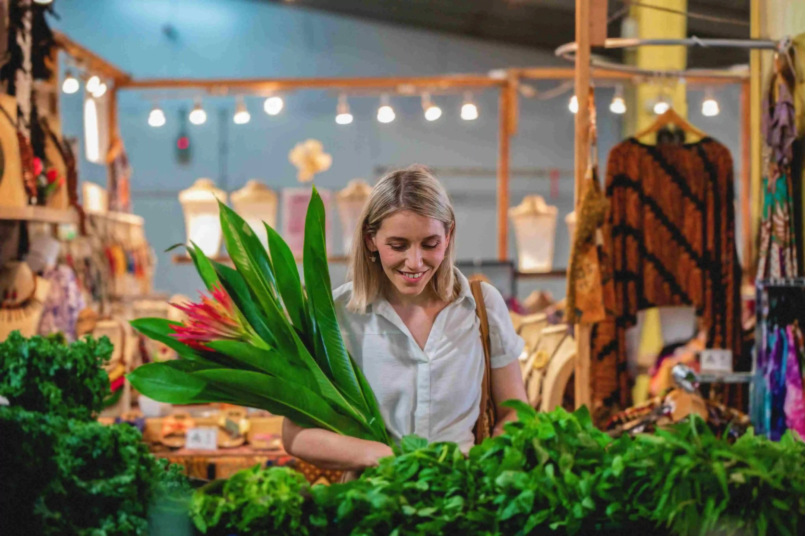 Girl looking down at vegetables in Rustys Market