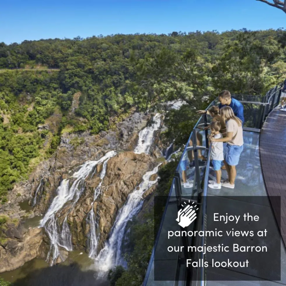 Guests looking at the Barron Falls at The Edge Lookout, Skyrail.