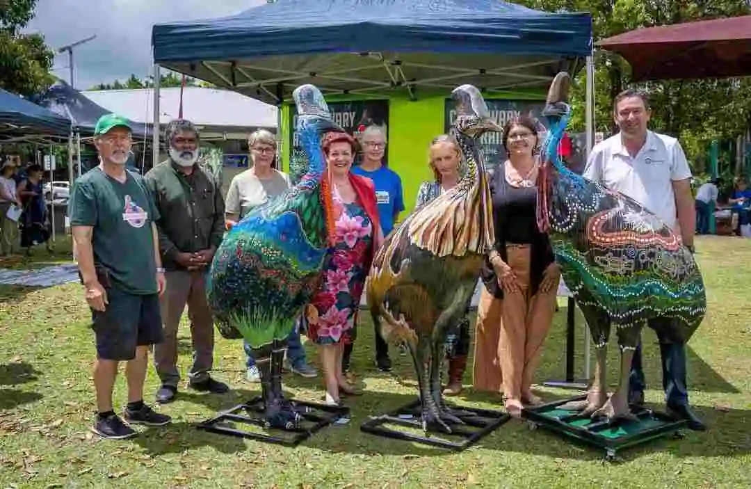 Artist group photo with painted cassowaries