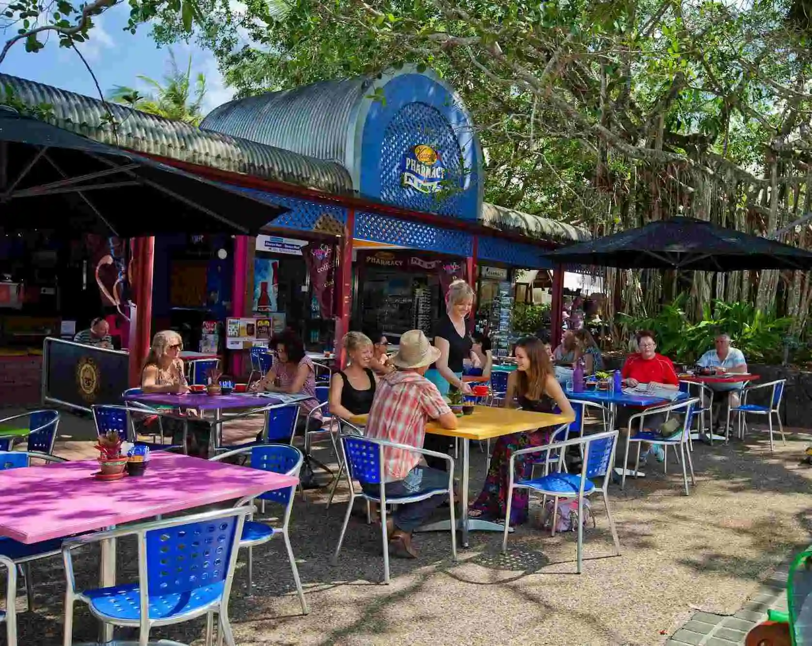 People sitting outside a cafe in Kuranda village